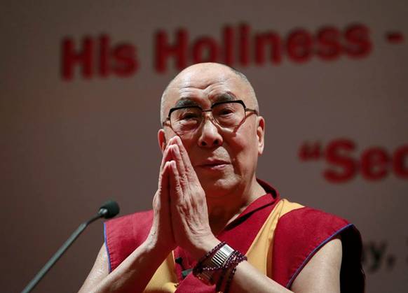 &copy; Reuters. FILE PHOTO: Exiled Tibetan spiritual leader the Dalai Lama gestures during a speech at the 108th anniversary of Indian Merchant Chambers in Mumbai September 18, 2014. REUTERS/Danish Siddiqui/File Photo