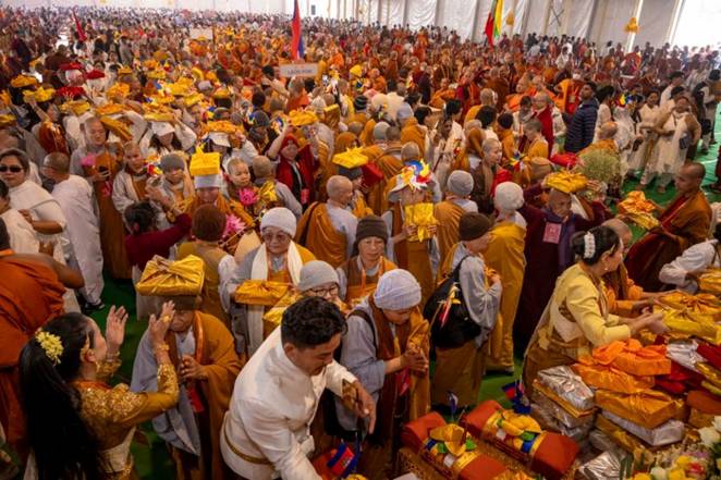 The annual ceremony draws practitioners from around the world to hear the Buddha's words and reflect upon his message